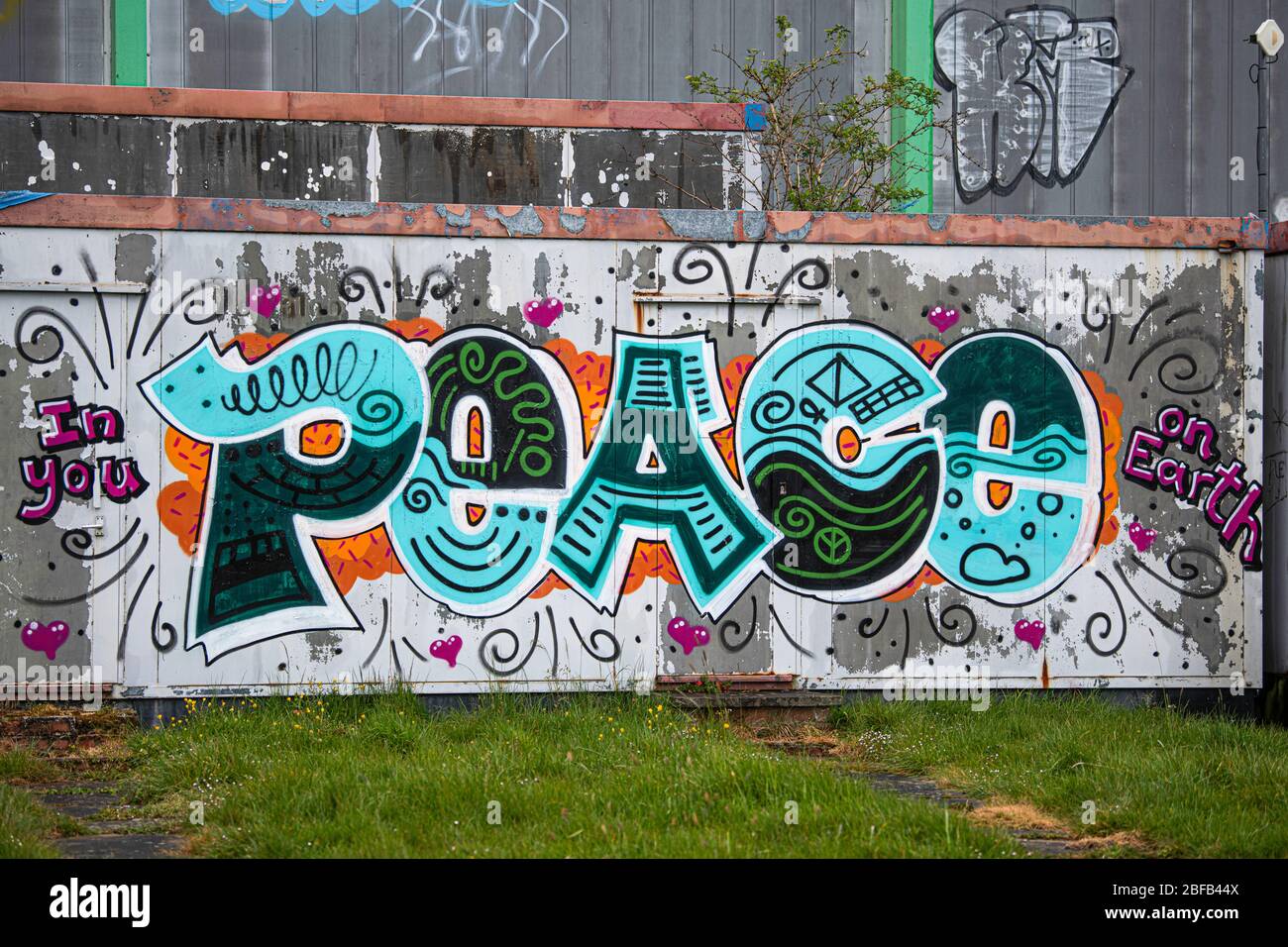 Peace on earth graffiti as local park become abandoned as the Covid 19 spreads across the cities with no one to be seen April 2020 Swindon Stock Photo