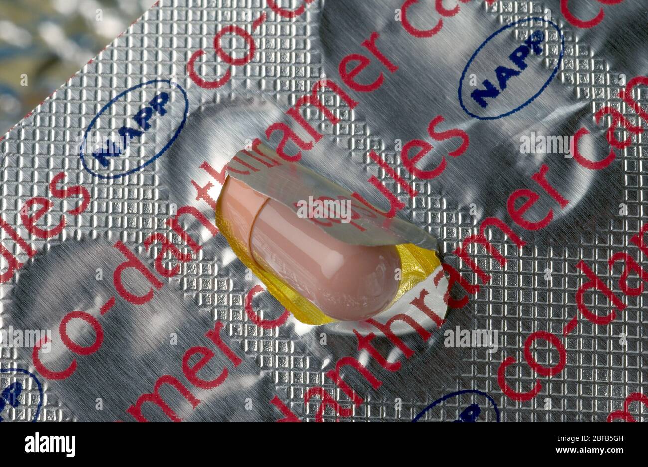 Close up of a co-danthramer capsule being removed from blister packaging. Co-danthramer is used as only by terminally ill patient suffering from const Stock Photo