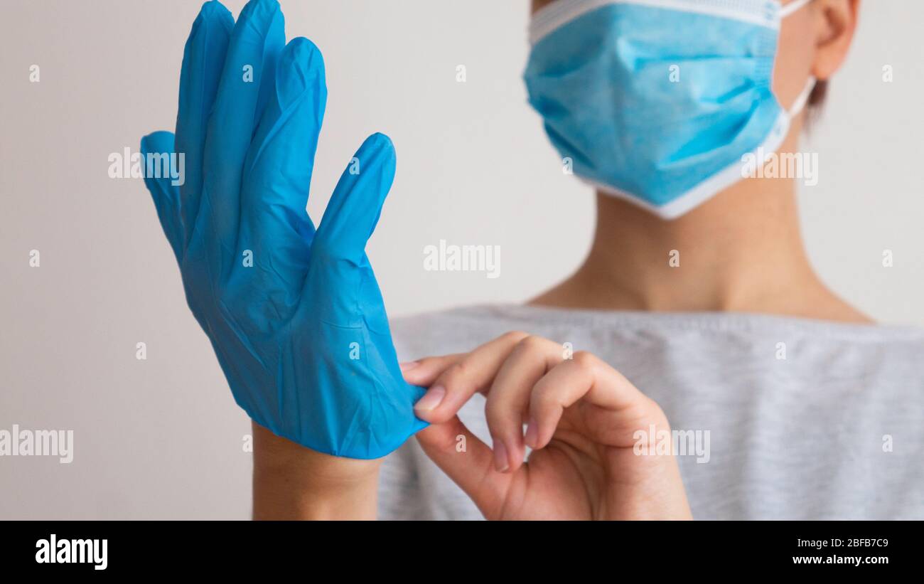 Professional puts face mask woman hi-res stock photography and images ...