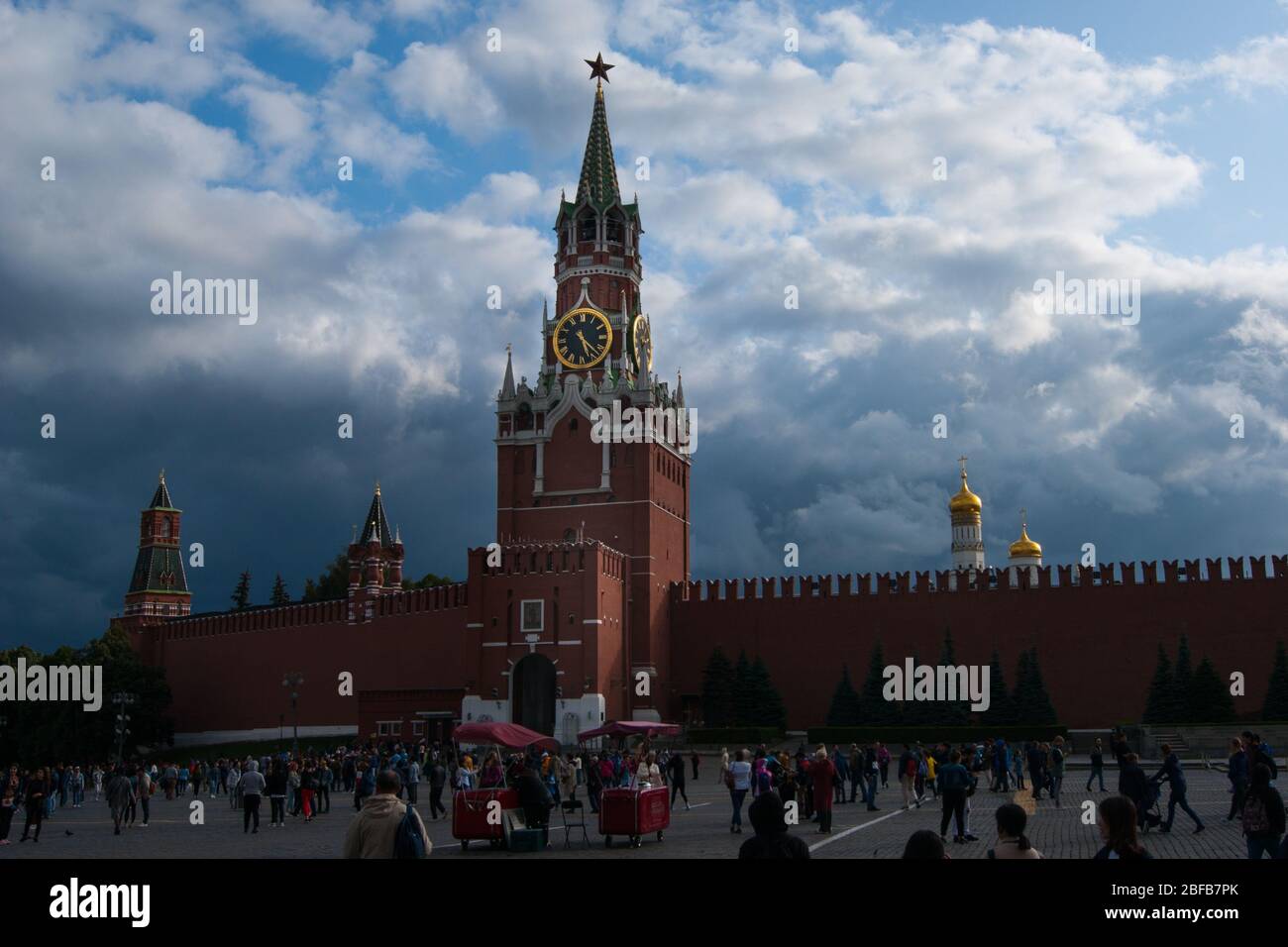 Moscow, Russia - August 2019. Moscow, the Kremlin, the Mausoleum on Red Square and many tourists of different nationalities walk on a cold summer clou Stock Photo