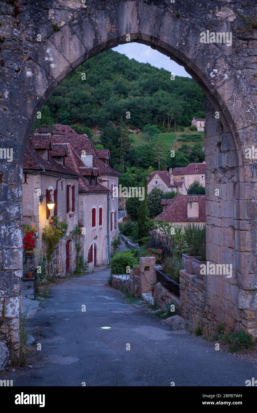 Pre-dawn at the old entry gate to medieval town of Saint-Cirq-Lapopie, Midi-Pyrenees, France Stock Photo