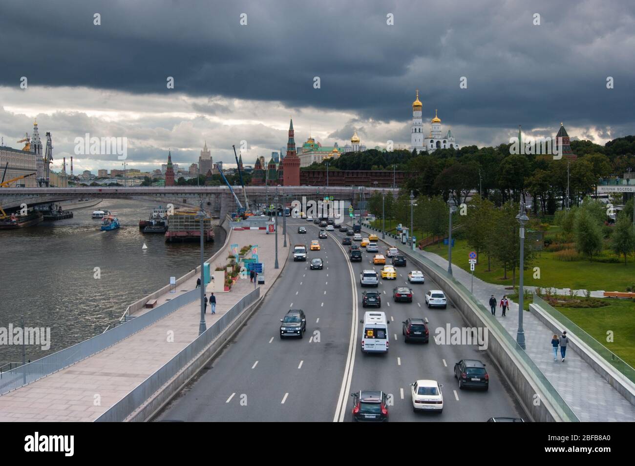 Moscow, Russia - August 2019. Moscow traffic. In the photo, a lot of cars - mainly passenger passenger taxis - rush along the three-lane road to the v Stock Photo