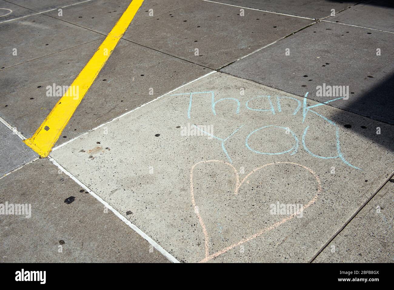 Messages left for medical workers on the sidewalk in front of NYU Langone Hospital. Stock Photo