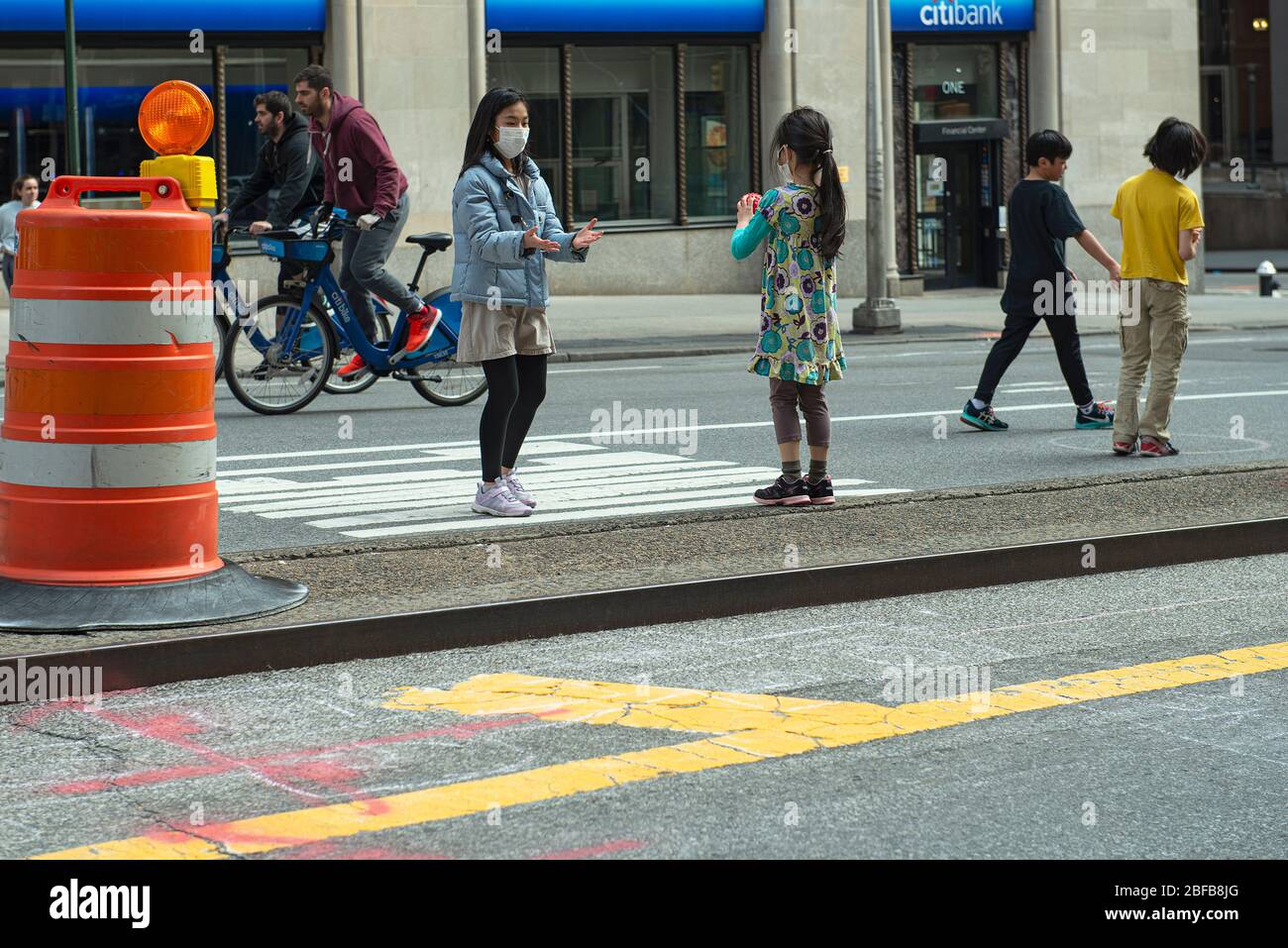 Children playing on the closed down Park Avenue South in Manhattan during the COVID19 pandemic in New York City. Stock Photo