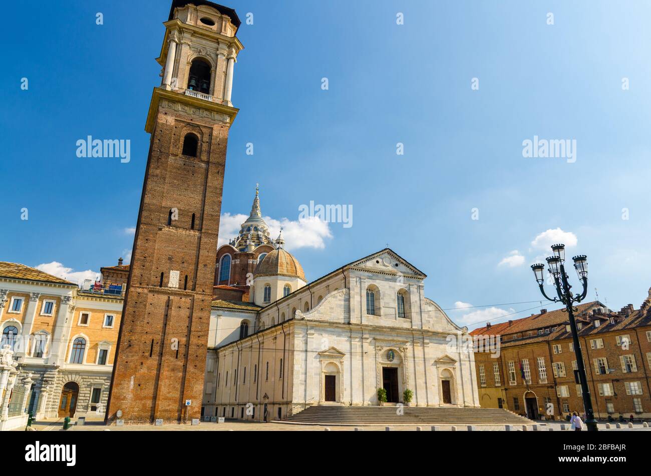 Duomo di Torino San Giovanni Battista catholic cathedral where the Holy Shroud of Turin is rested with bell tower and Sacra Sindone chapel on square i Stock Photo