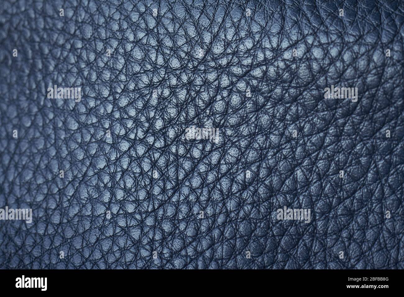 Extremely close-up natural qualitative blue leather texture, selective focus Stock Photo