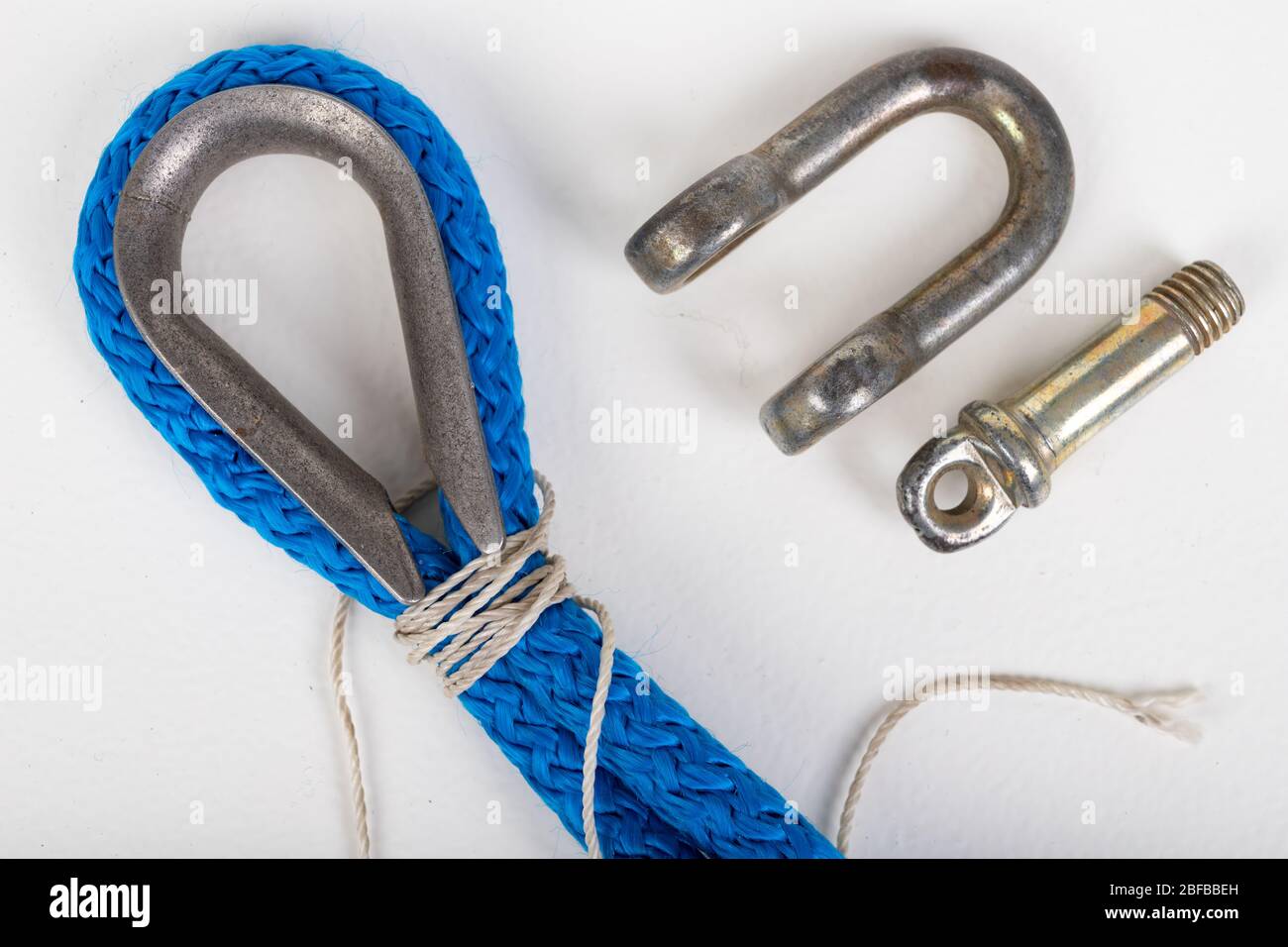 Repair of sailing ropes and slings. Sailor accessories. Light background. Stock Photo