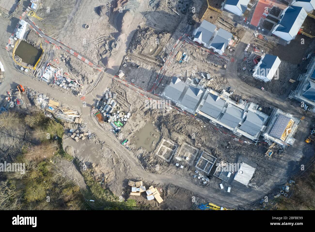 Construction building site aerial view materials pipes machinery equipment Stock Photo