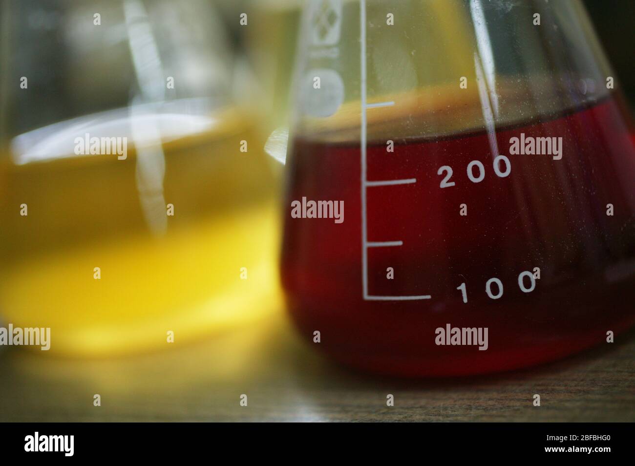 Erlenmeyer flasks containing coloured liquid Stock Photo Alamy