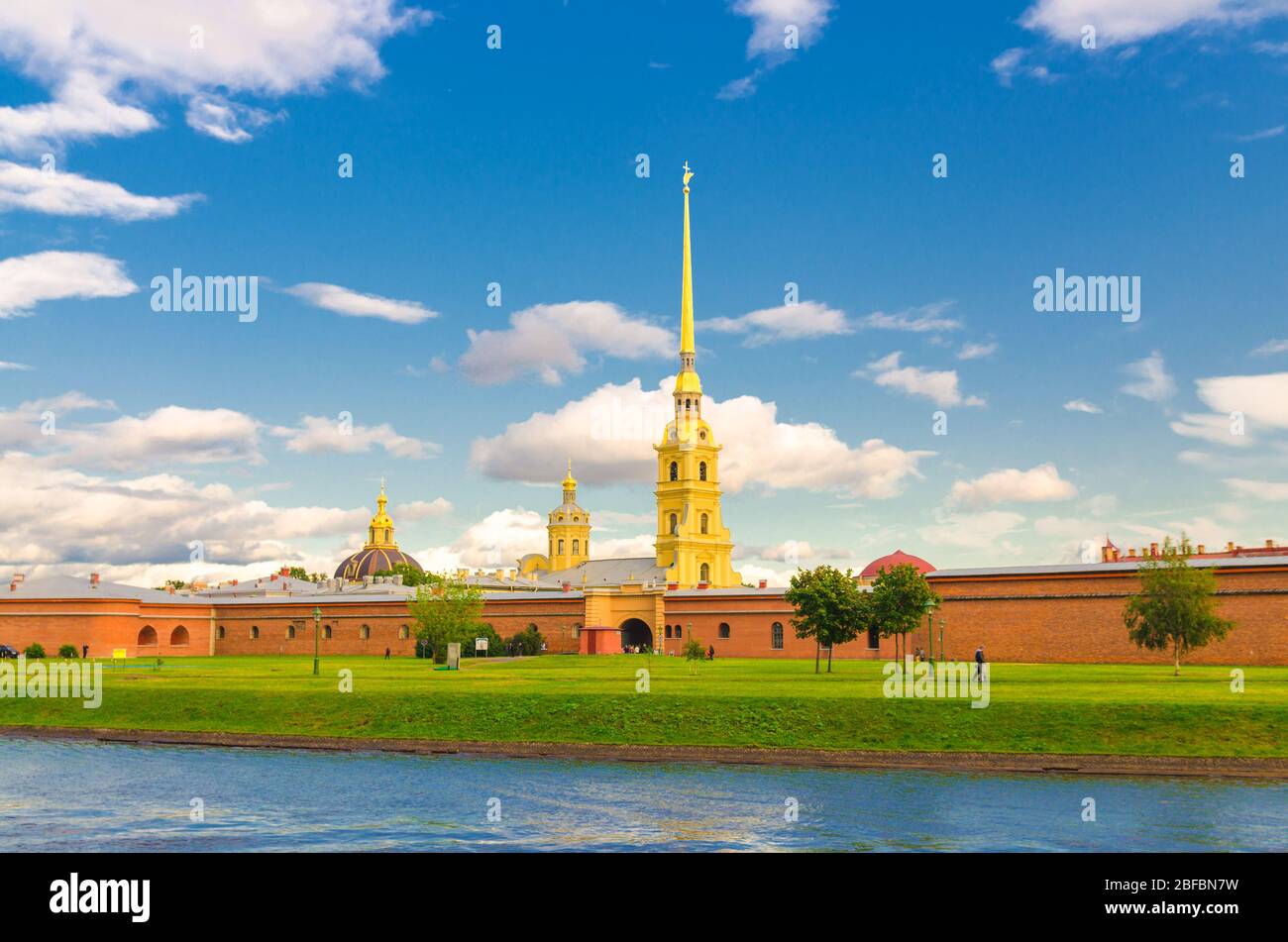 The Peter and Paul Fortress, Saints Peter and Paul Cathedral Orthodox church gold spire, fortress walls on Zayachy Hare Island, Kronverksky Strait cha Stock Photo