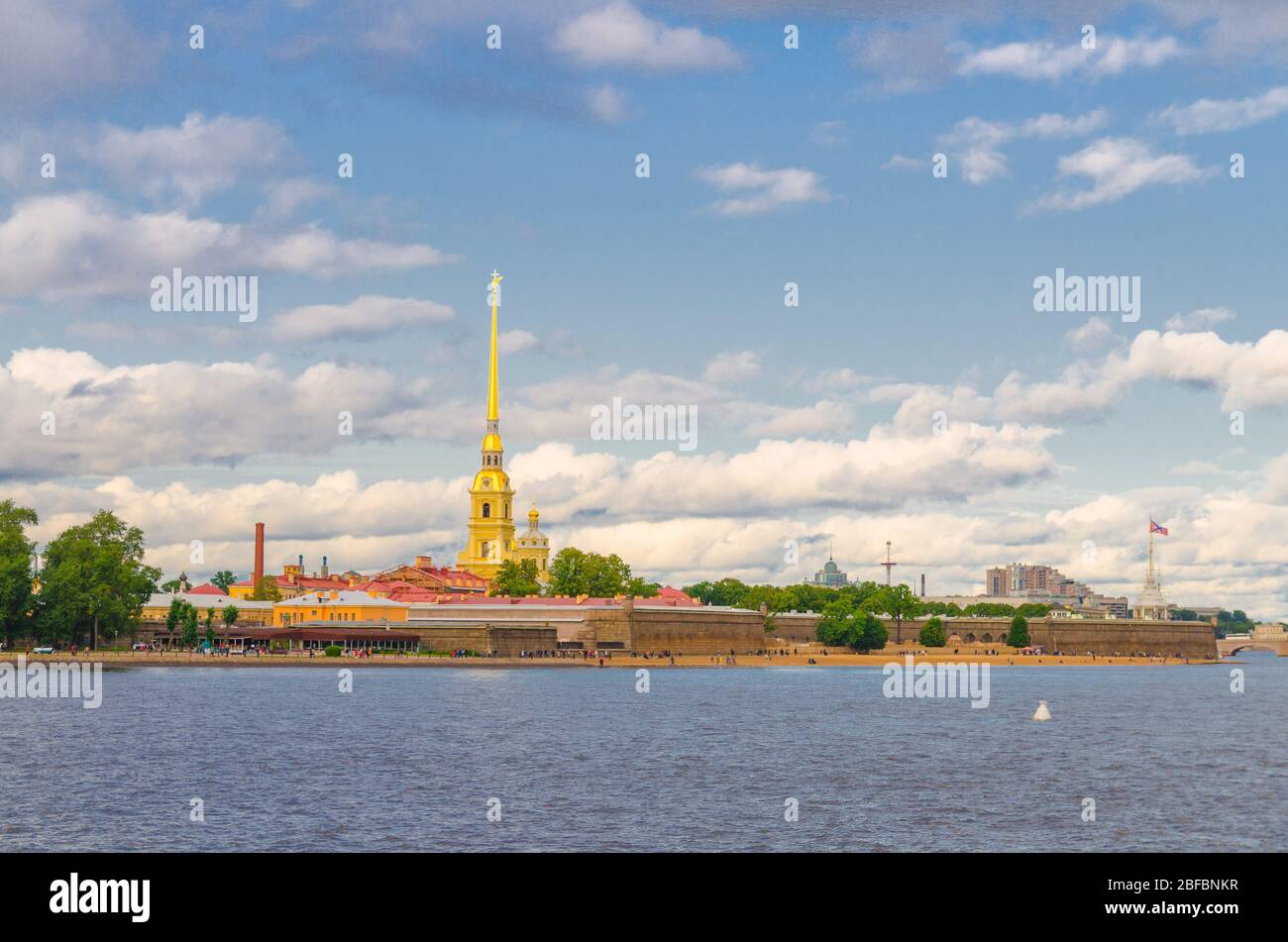 The Peter and Paul Fortress citadel, Saints Peter and Paul Cathedral Orthodox church with gold spire, fortress walls on Zayachy Hare Island, Neva rive Stock Photo