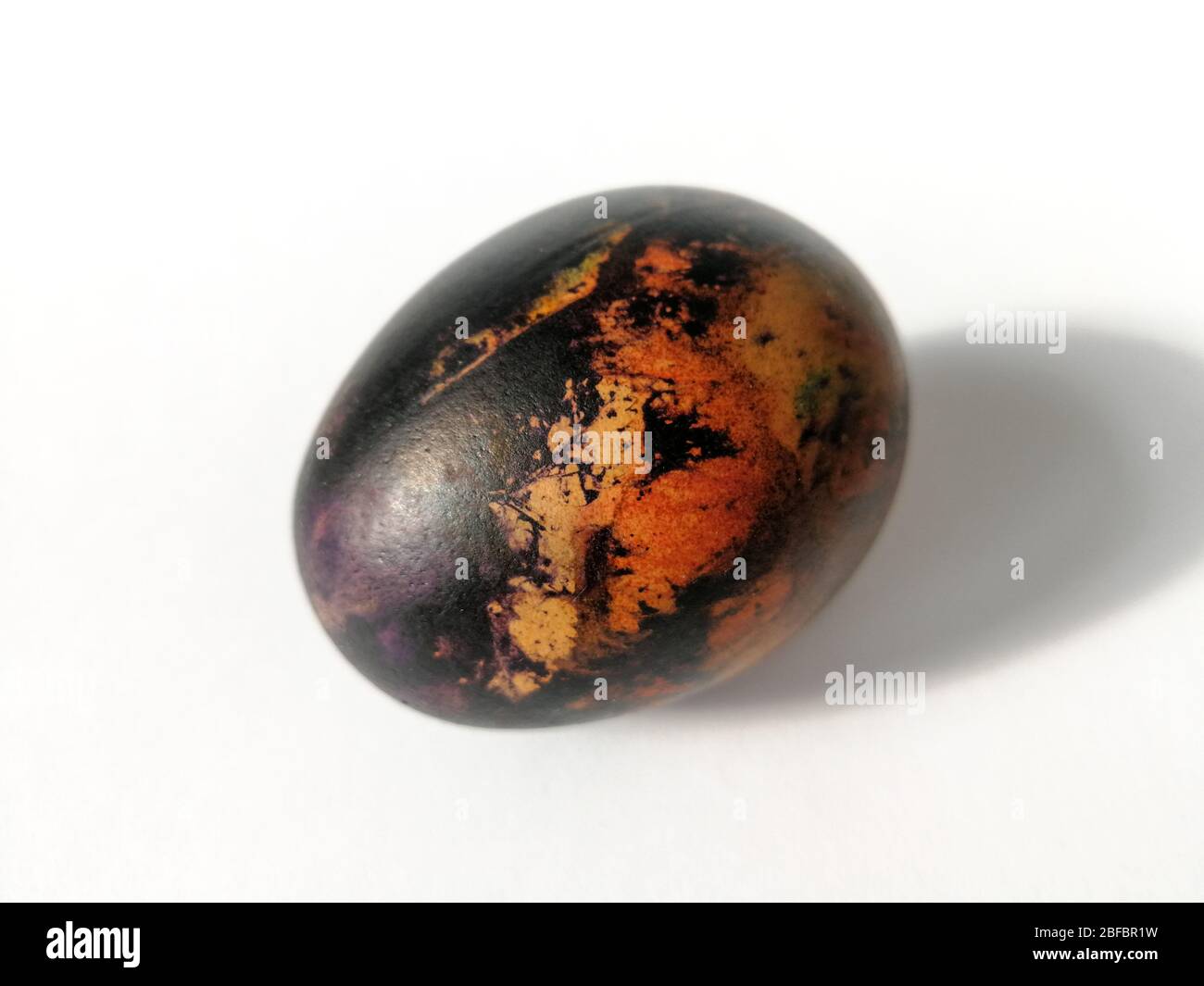 Traditionally lithuanian painted Easter egg isolated on the white background Stock Photo