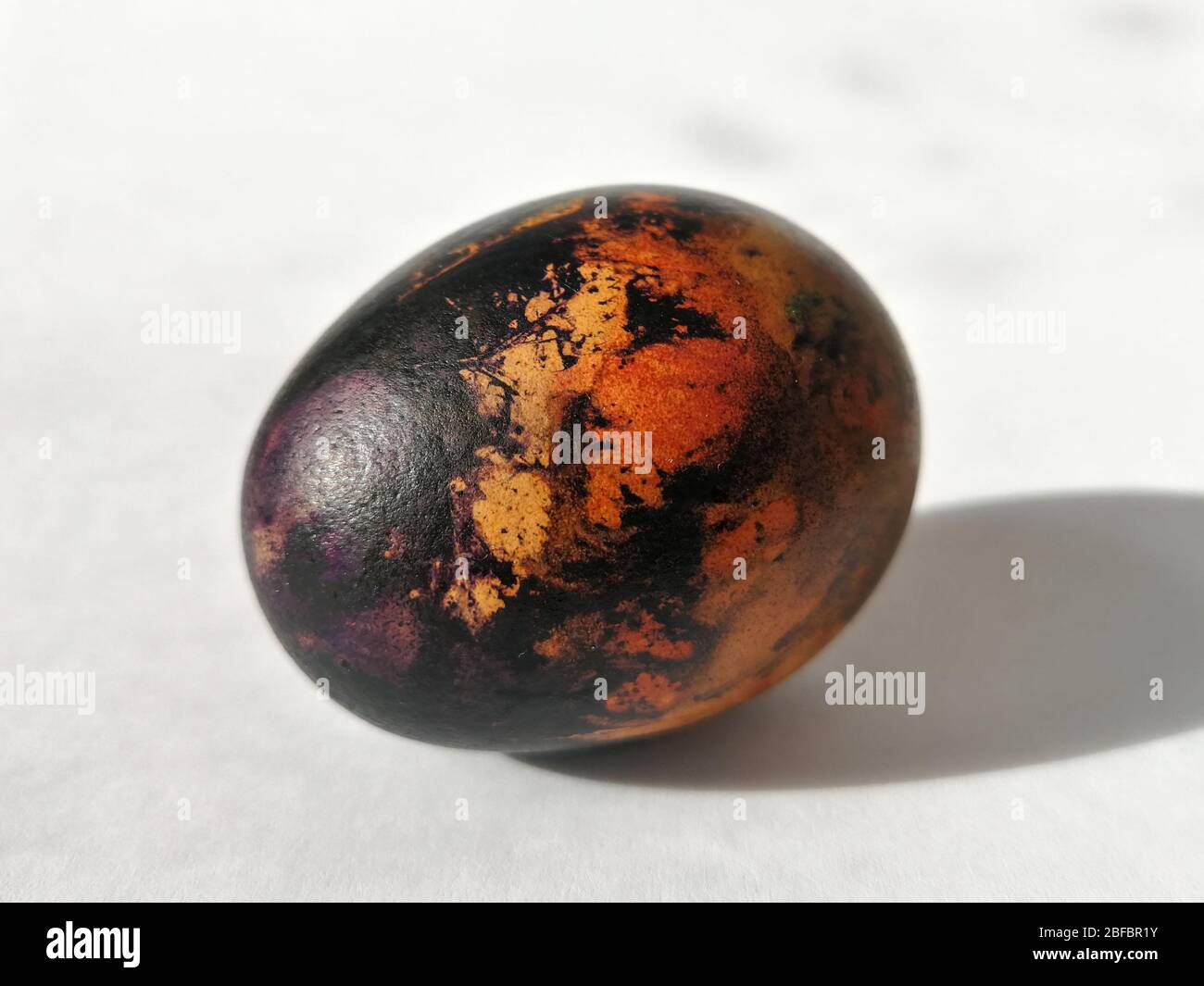 Traditionally lithuanian painted Easter egg isolated on the white background Stock Photo