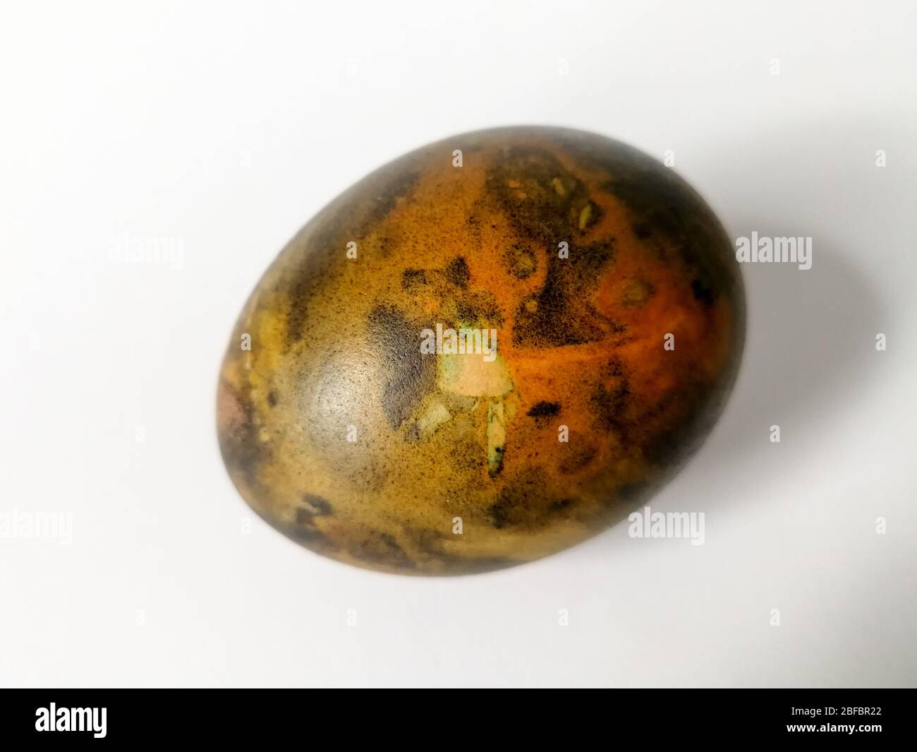 Traditionally lithuanian painted Easter egg isolated on the white background Stock Photo