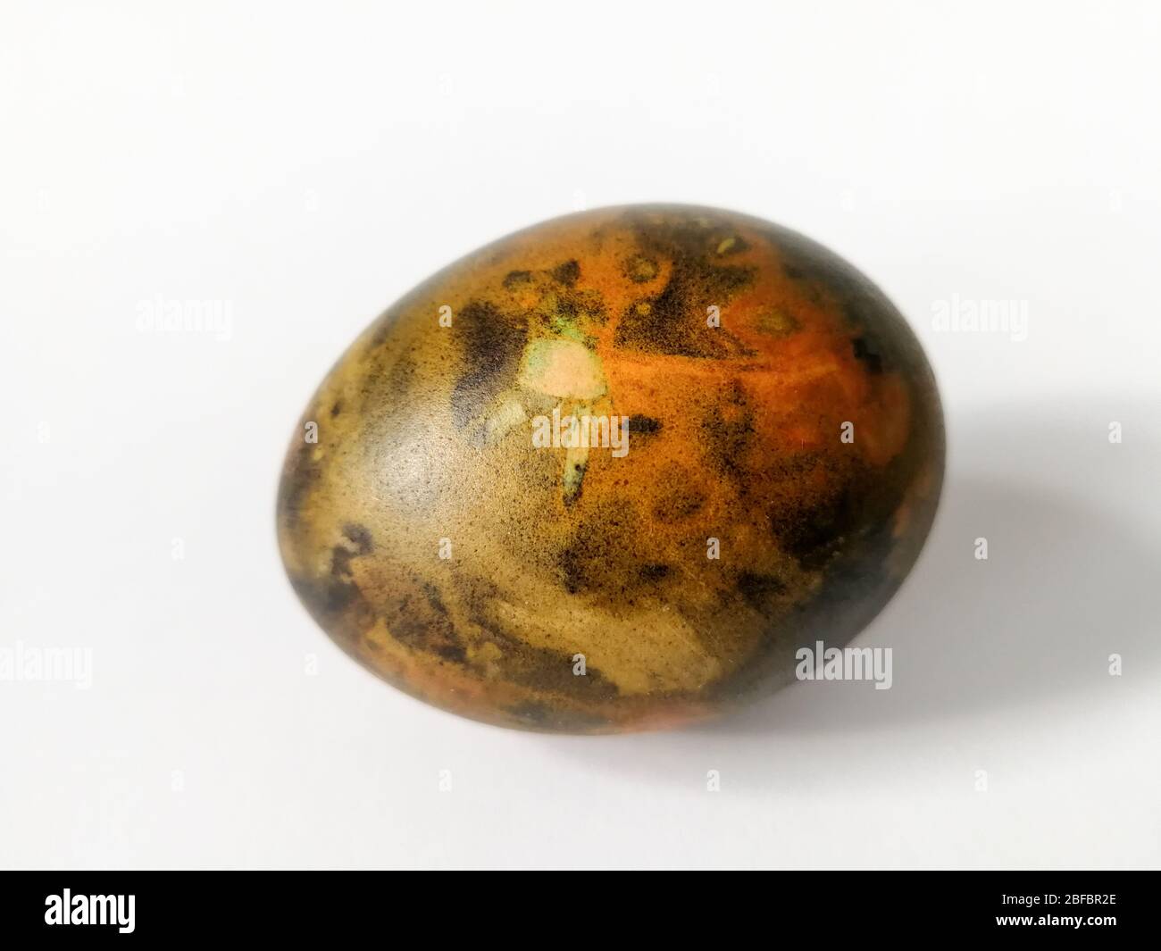 Traditionally lithuanian painted Easter egg isolated on the white background Stock Photo