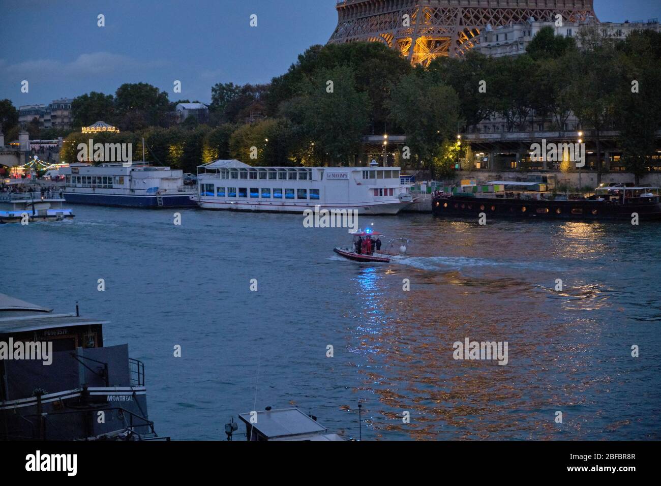 Fire Brigade Patrol Boat Near Eiffel Tower Stock Photo