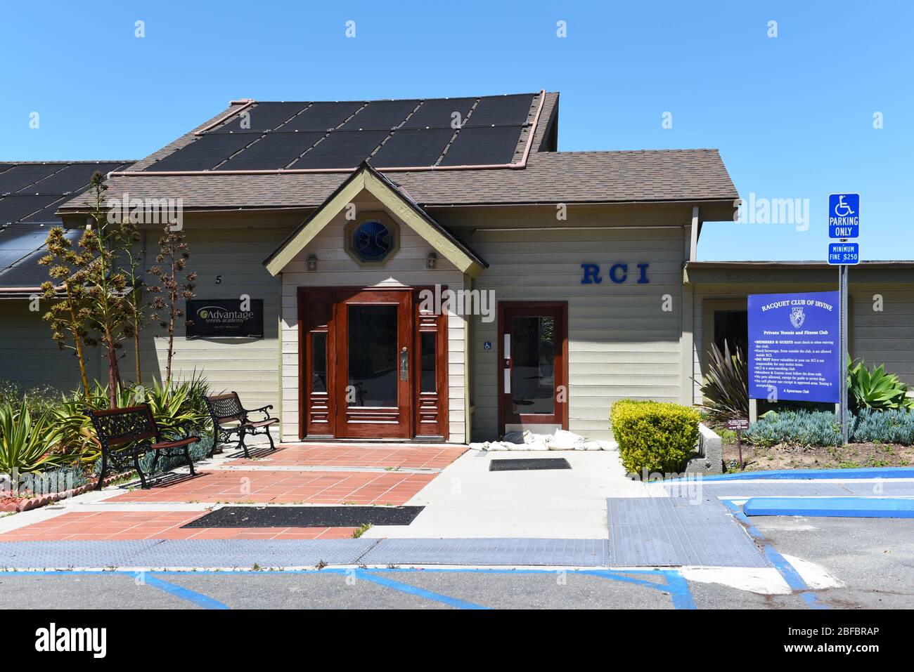 IRVINE, CALIFORNIA - 16 APRIL 2020: Entrance at The Racquet Club of Irvine, RCI, is a Tennis Facility that also offers full fitness facilities and oly Stock Photo