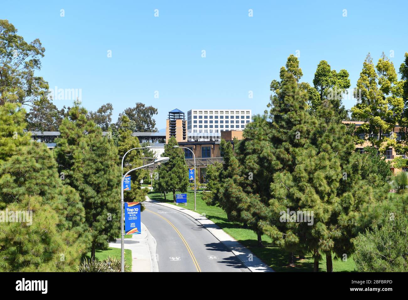 IRVINE, CALIFORNIA - 16 APRIL 2020: Peltason Drive through the campus at the University of California Irvine, UCI. Stock Photo