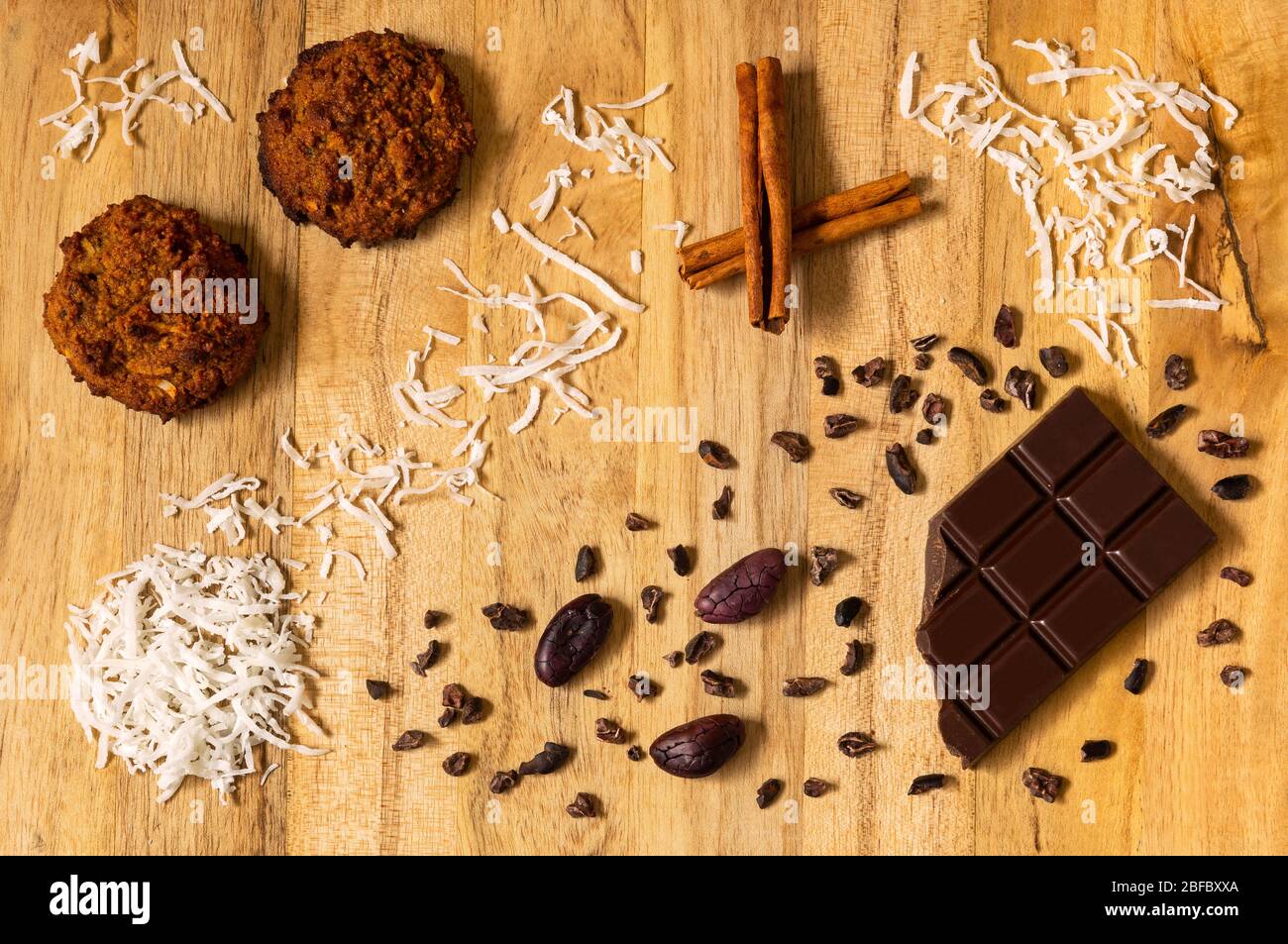 Learning to cook in Corona Quarantine Lockdown? Coconut Cookies with black single origin Ecuadorian Chocolate and a touch of Cinnamon. Stock Photo