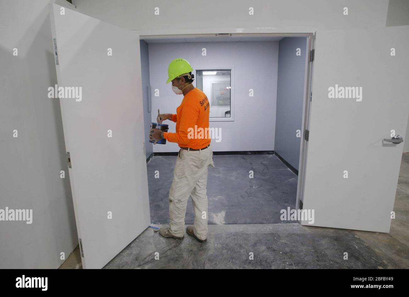 Earth City, Missouri, USA. 17th Apr 2020. A painter puts the finishing touches on trim in a body viewing room in a overflow morgue, in Earth City, Missouri on Friday, April 17, 2020. The Dignified Transfer Center, built in just ten days, is a 29,000 square-foot facility that was built out of preparedness that will provide relief to hospitals, morgues and funeral homes.   Louis County to natural causes, medical events Credit: UPI/Alamy Live News Stock Photo