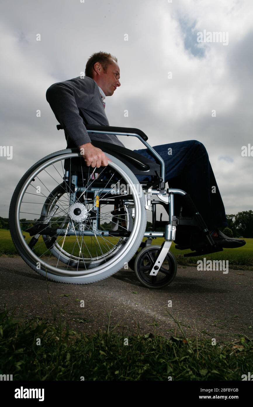 Male in wheelchair using hi-res stock photography and images - Alamy