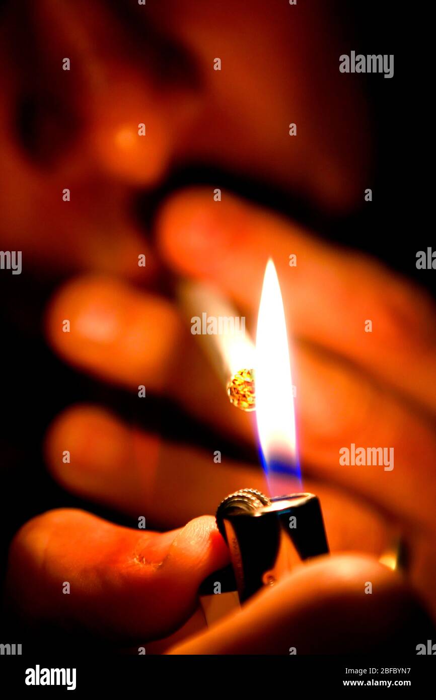 A close up picture man lighting cigarette his hires stock photography and images Alamy