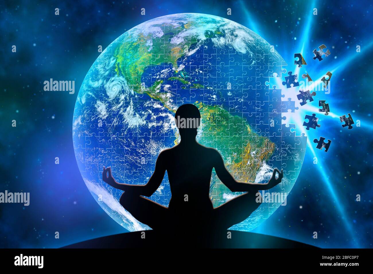 Female yoga figure against a space background and a planet Earth made of jigsaw puzzle during disintegration becouse of explosion. Elements of this im Stock Photo