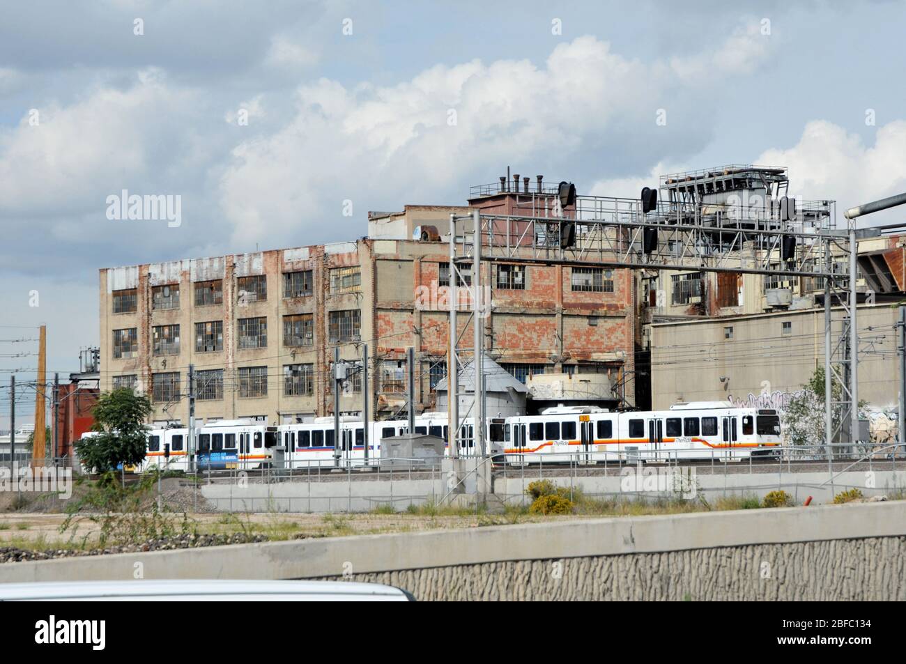 DENVER, CO/USA SEPT 13, 2013 An RTD Light Rail train passes the old