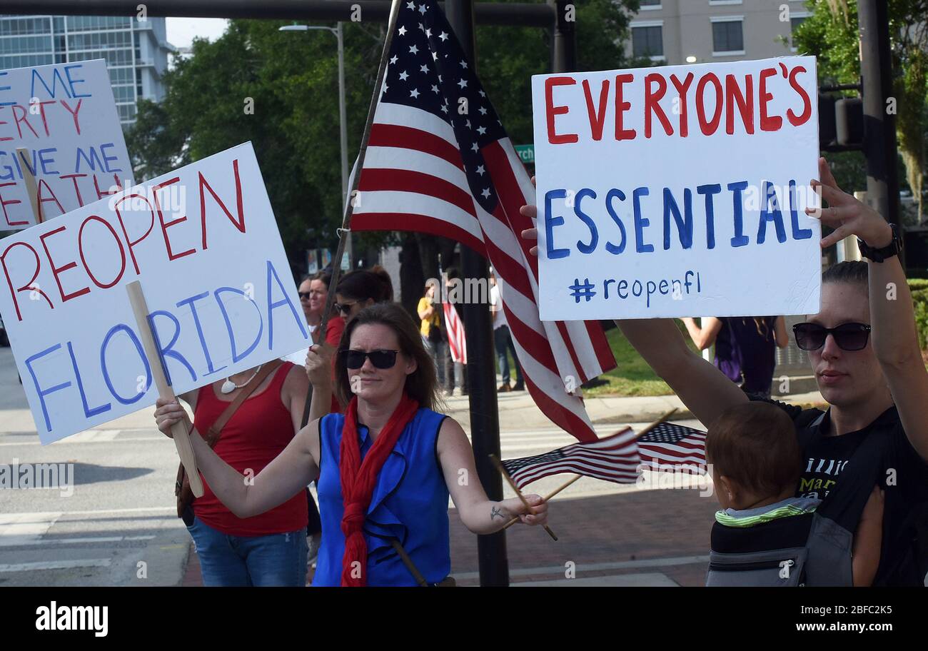 April 17, 2020 - Orlando, Florida, United States - Protesters demonstrate outside the Orange County Administration Building in Orlando, Florida on April 17, 2020 demanding the end of stay-at-home orders and the reopening of Florida businesses as the COVID-19 pandemic keeps thousands of people in their homes and out of work. (Paul Hennessy/Alamy) Credit: Paul Hennessy/Alamy Live News Stock Photo