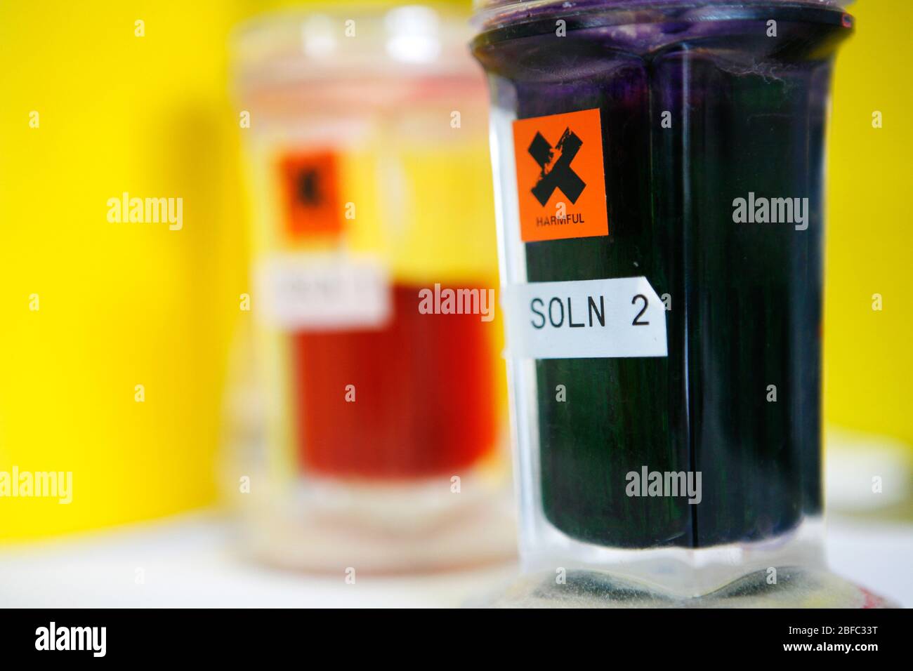 Close up harmful warning label on various glass hires stock