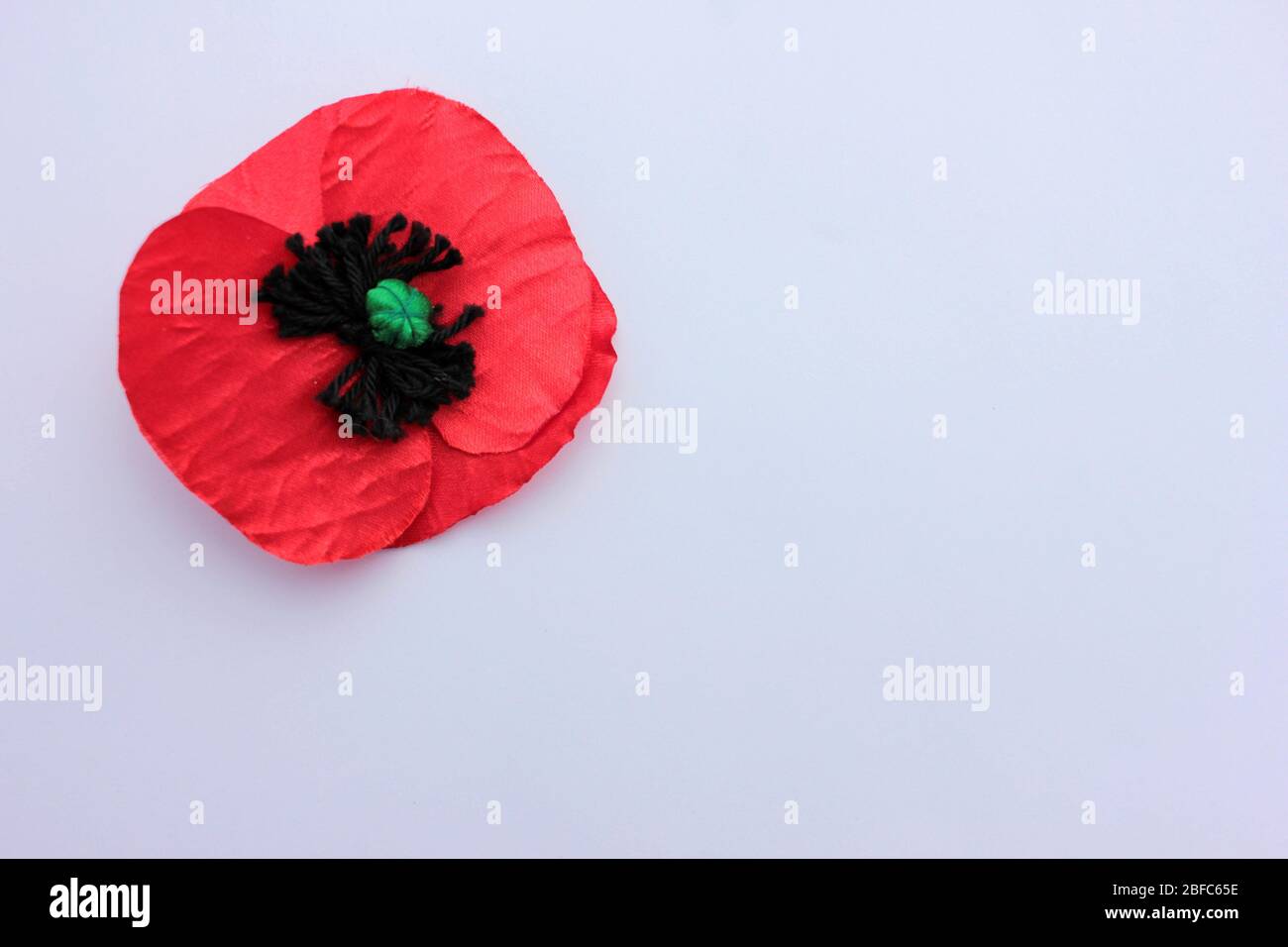 USA Memorial Day concept of red remembrance poppy made from fabric on ...