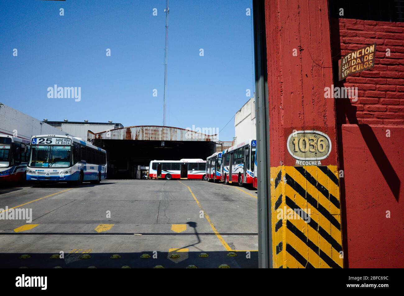 Buenos Aires, Argentina - January, 2020: Group of buses parked in a city bus garage. Necochea 1036 street in Buenos Aires. Parking lot depot of city p Stock Photo