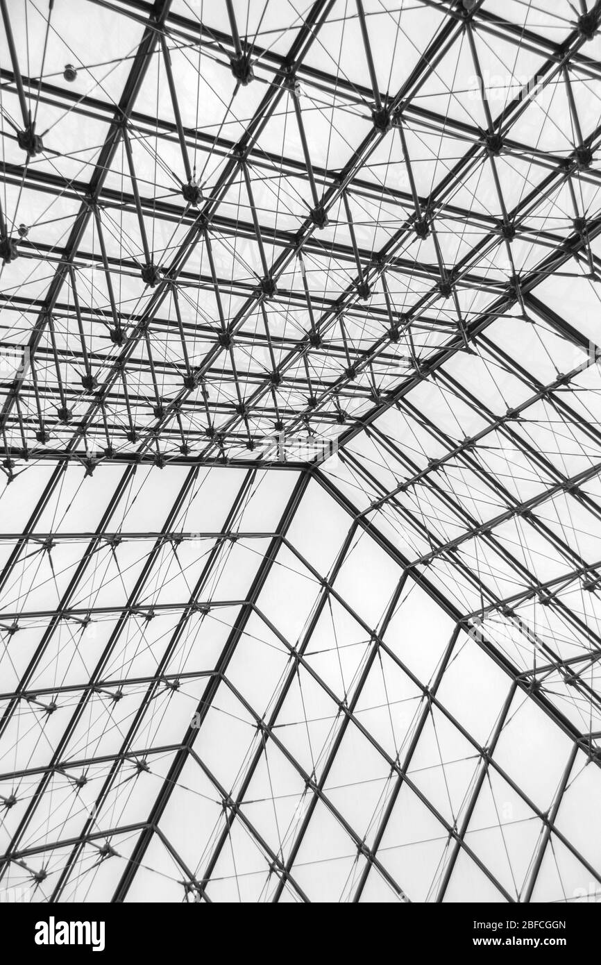 Geometric glass ceiling inside the pyramid of the Louvre Stock Photo