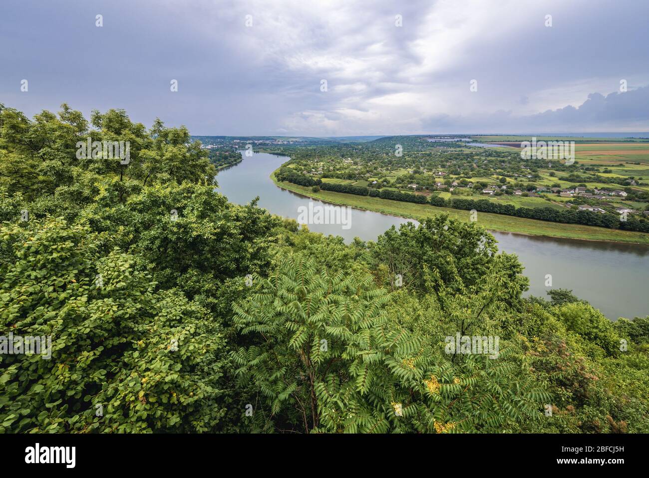 Dniester River, natural border between Moldova and Ukraine - view from hill with Candle Monument in Soroca, Moldova with Ukrainian village Tsekynivka Stock Photo