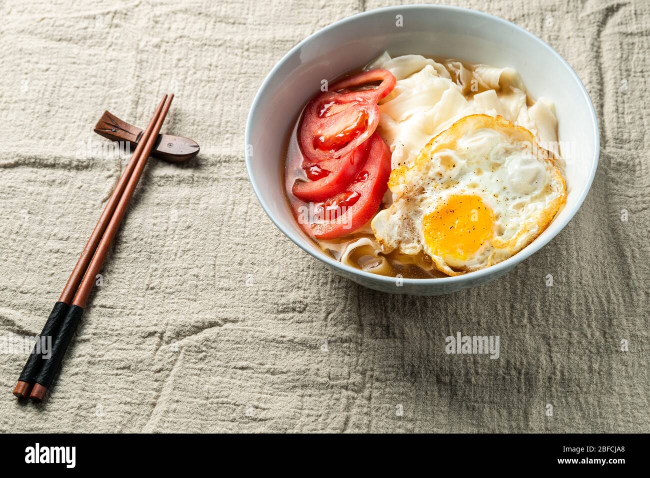 Chinese Traditional noodles with tomatoes and eggs Stock Photo