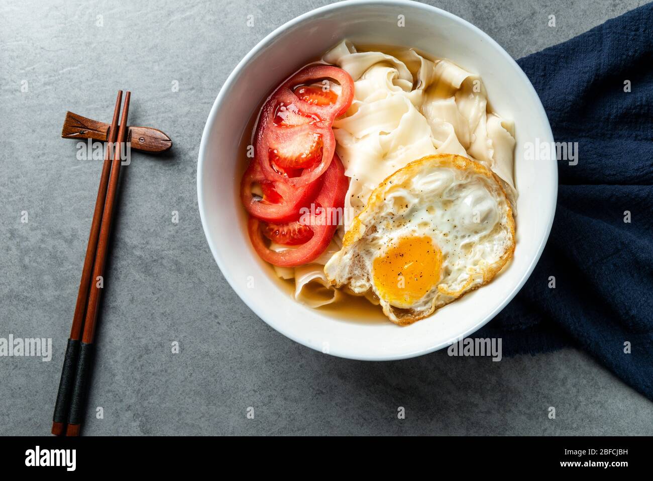 Chinese Traditional noodles with tomatoes and eggs Stock Photo