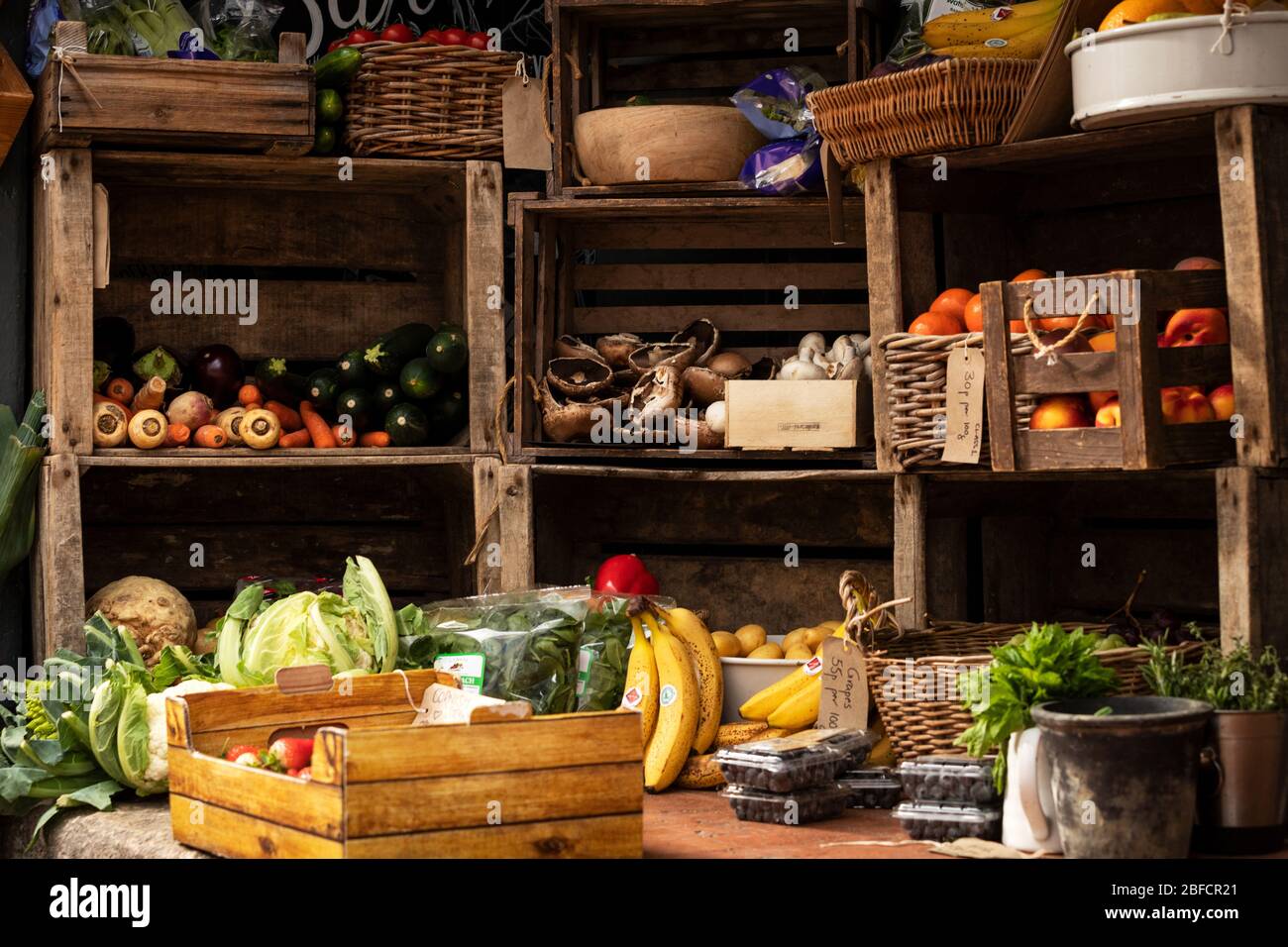 Fruit and vegetables display in wooden crates Stock Photo - Alamy