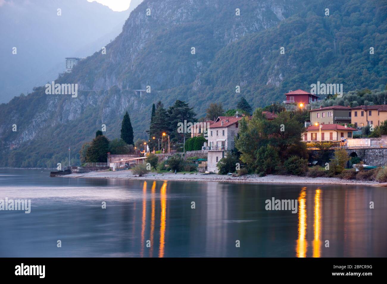 Early morning long exposure shot of a village at the coasts of lake Como, Italy Stock Photo