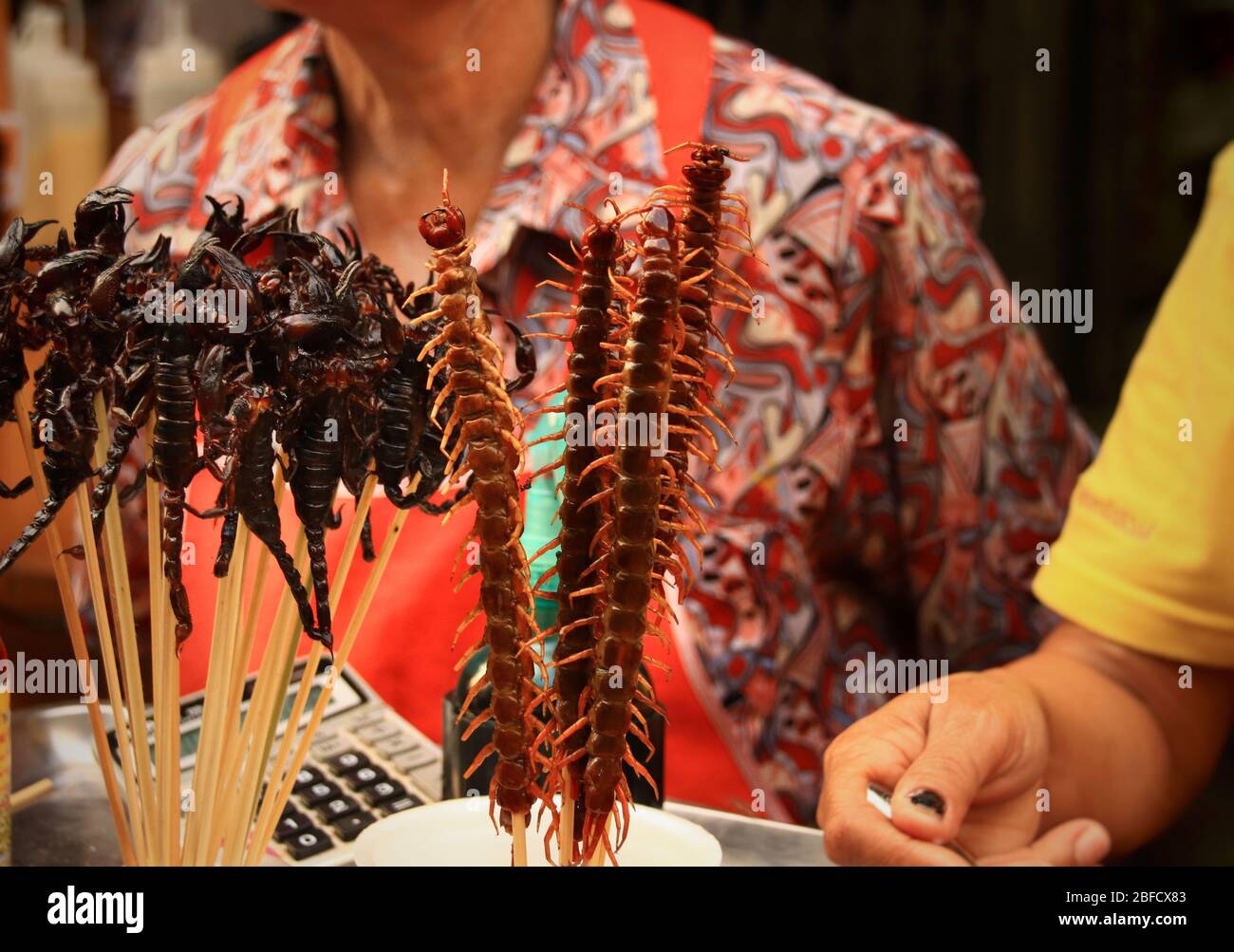 Fried centipedes and scorpions, exotic and traditional street food that shows the culture and cuisine of Thailand Stock Photo