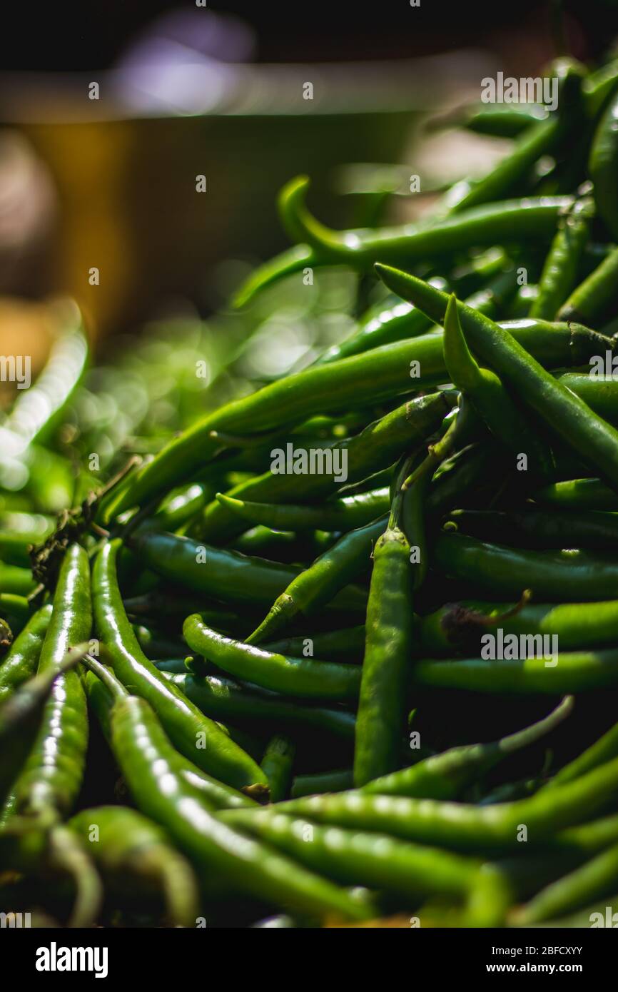 Green chilli peppers for sale at street market. Green Chillis freshly