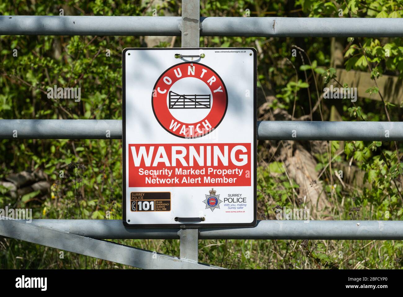 Country Watch notice, warning security marked property, on a gate in the countryside, UK Stock Photo