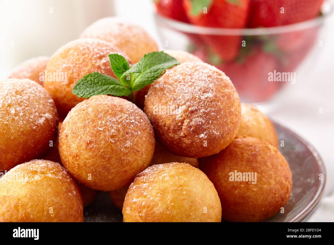 Beautiful breakfast. Cottage cheese donuts  balls  on a light background close up. Stock Photo