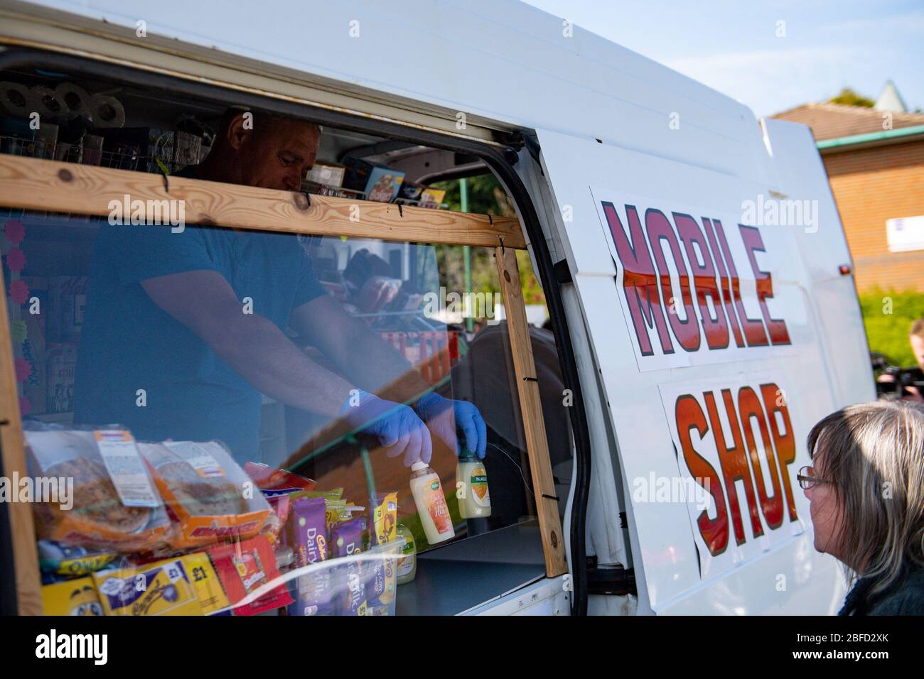 Residents of Anchor Court use Toni Marshall and her partner Ian Peat's mobile shop in Nottingham, bringing groceries to vulnerable and elderly customers who don't want to stray far from home during the Covid-19 lockdown. Stock Photo