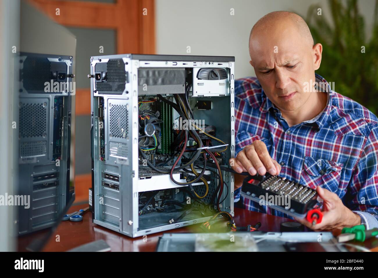 Computer repair. Computer technician working on a personal computer ...