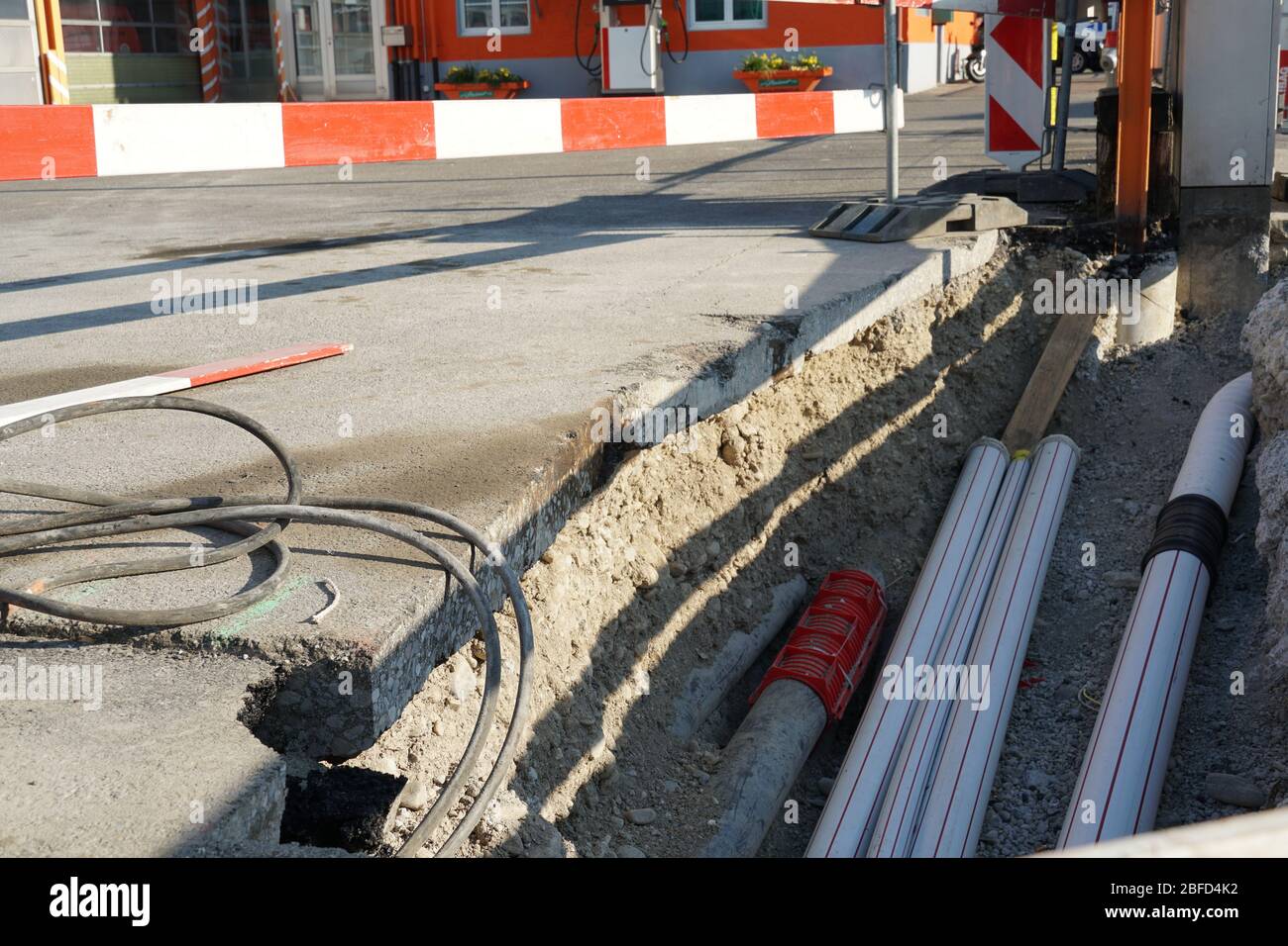 new pipes laid in a civil engineering shaft in the street with vertical