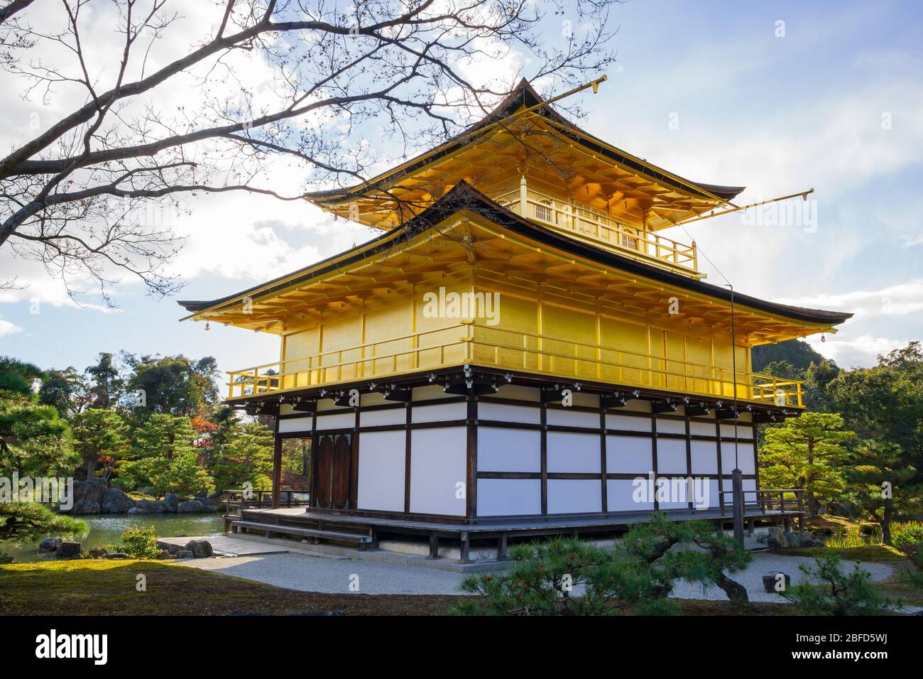 Kinkakuji Zen Buddhist Temple is an impressive structure built overlooking a large pond, known as a retirement complex. Stock Photo