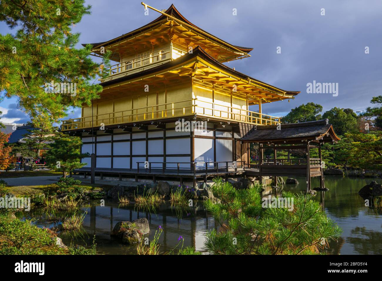 Kinkakuji Zen Buddhist Temple is an impressive structure built overlooking a large pond, known as a retirement complex. Stock Photo
