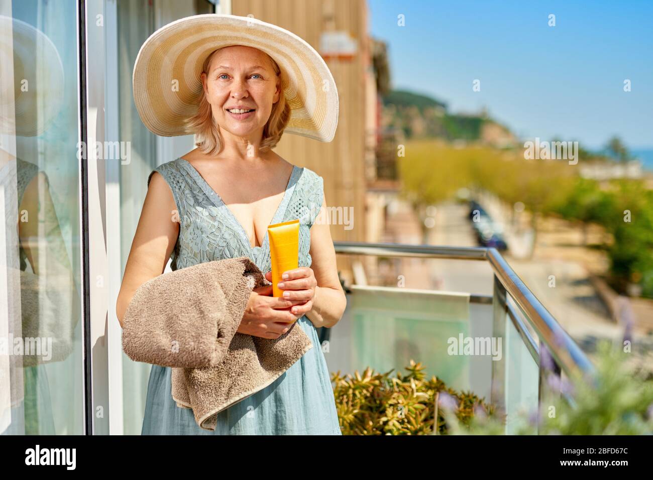 happy mature woman at terrace with sea shore Stock Photo - Alamy