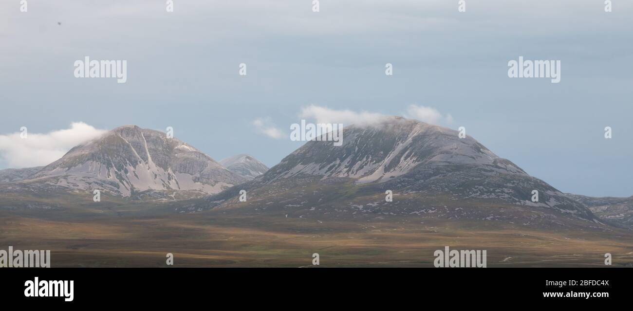 Looking across the sea to mountains on the island of Jura, from the Isle of Islay in Scotland. Stock Photo