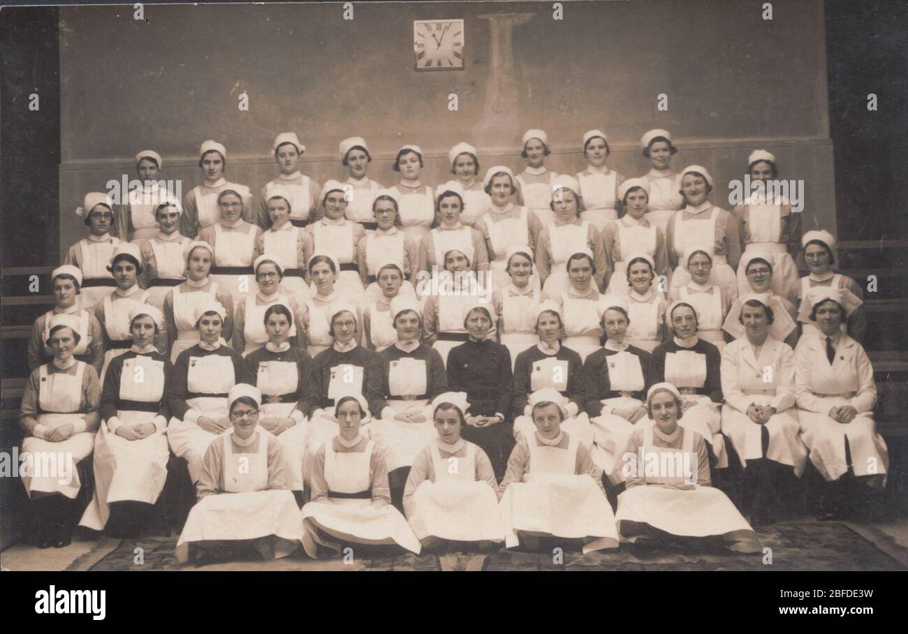 Vintage Photographic Postcard Showing a Group of British NHS Nurses. Stock Photo